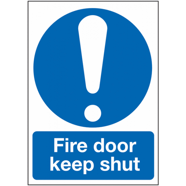 Keep shut choose someone. Fire Escape sign. Keep Clear. Keep Clear of the Door.